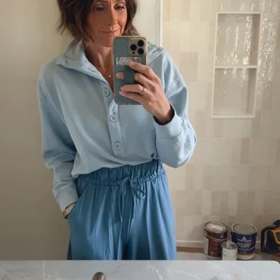 Shop Marisa’s blue outfit